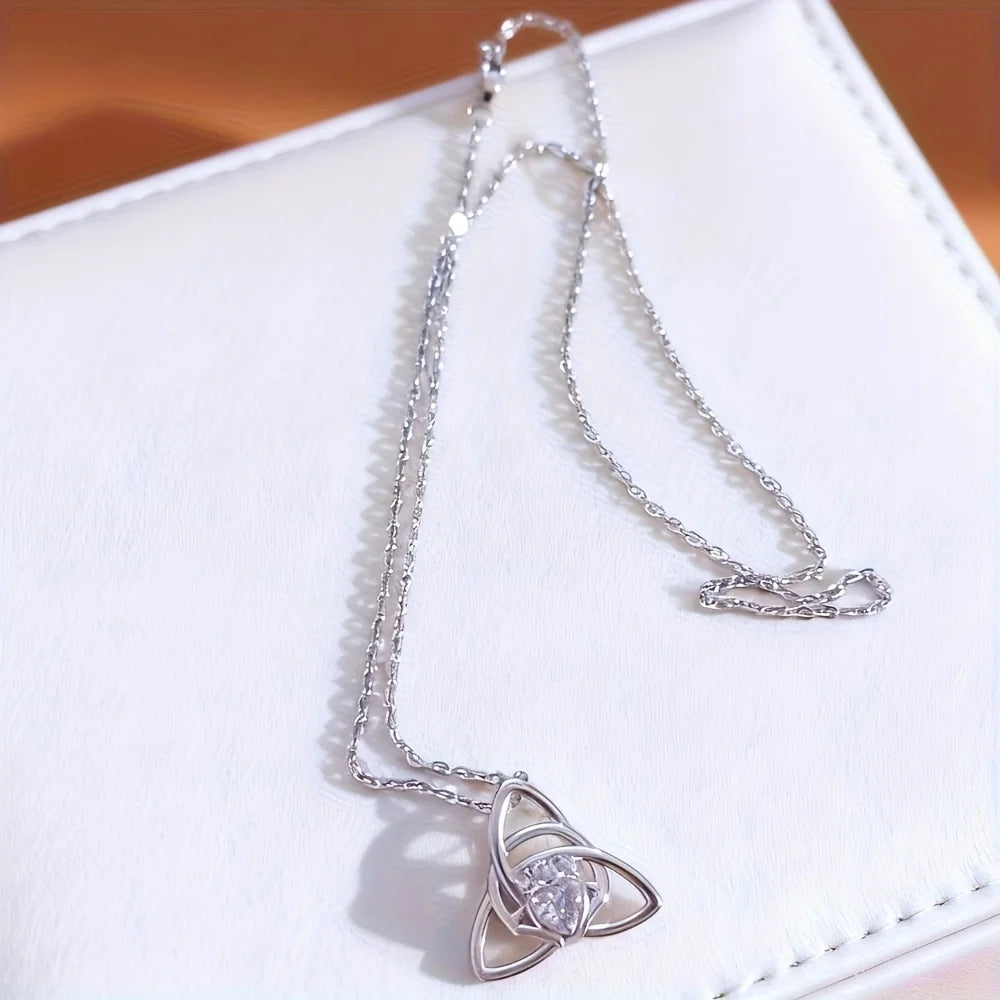 A Celtic knot triangle necklace - interwoven knot design, set with white synthetic zircon