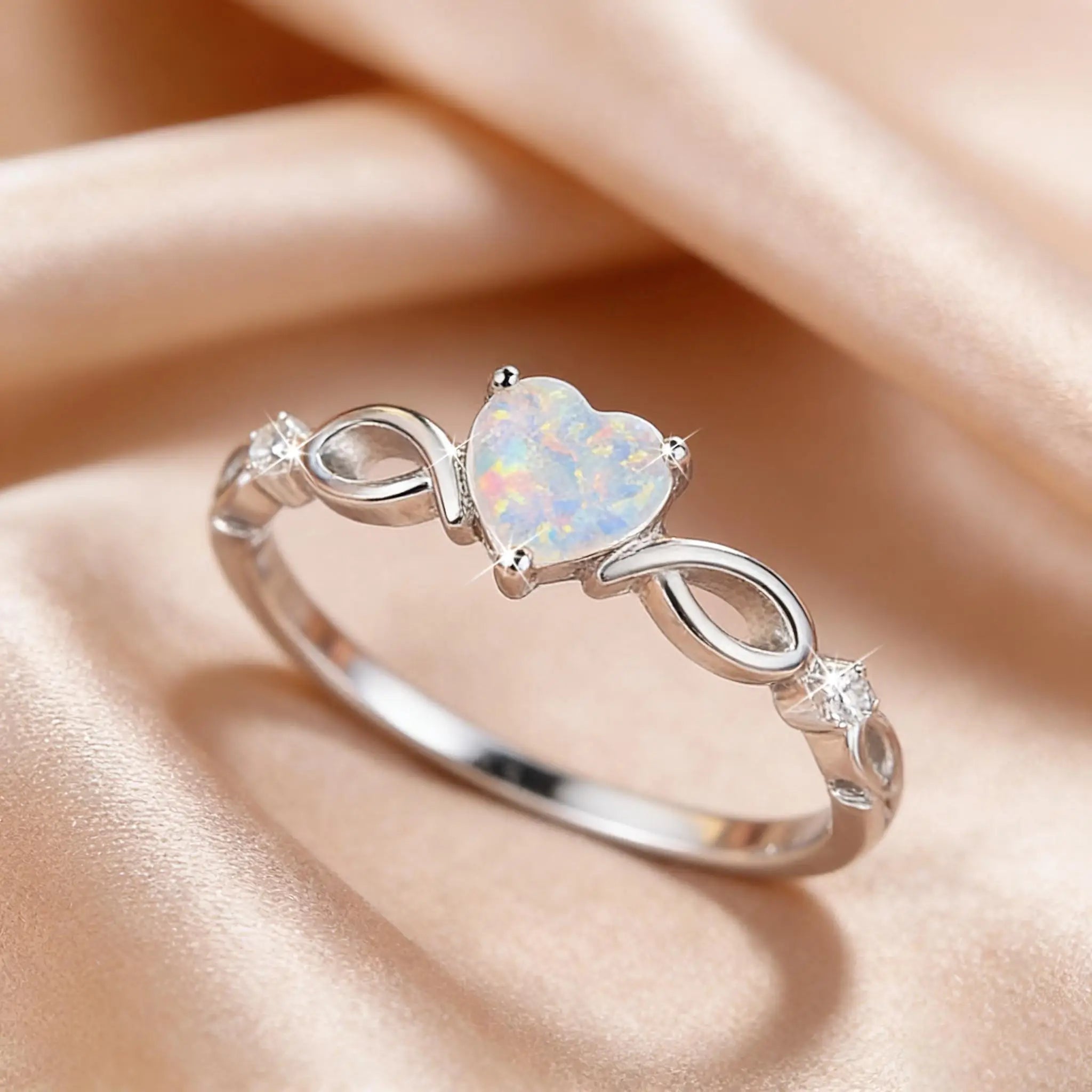 A heart-shaped opal silver ring with elegant and dynamic style, exquisite infinite symbol design