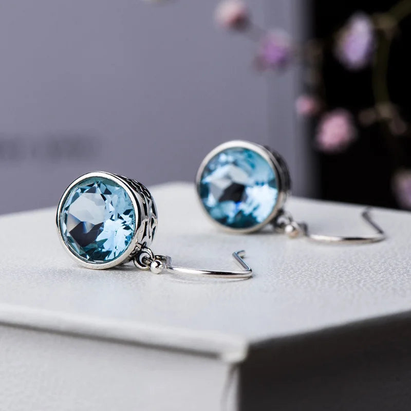 Beautiful Earrings inlaid with sea-blue synthetic zircon carved patterns