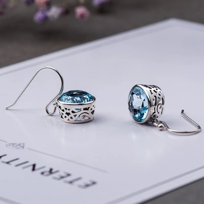 Beautiful Earrings inlaid with sea-blue synthetic zircon carved patterns