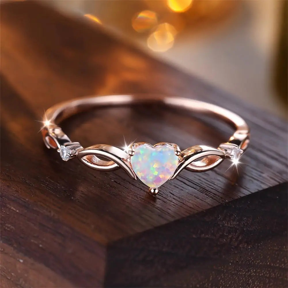 A heart-shaped opal silver ring with elegant and dynamic style, exquisite infinite symbol design