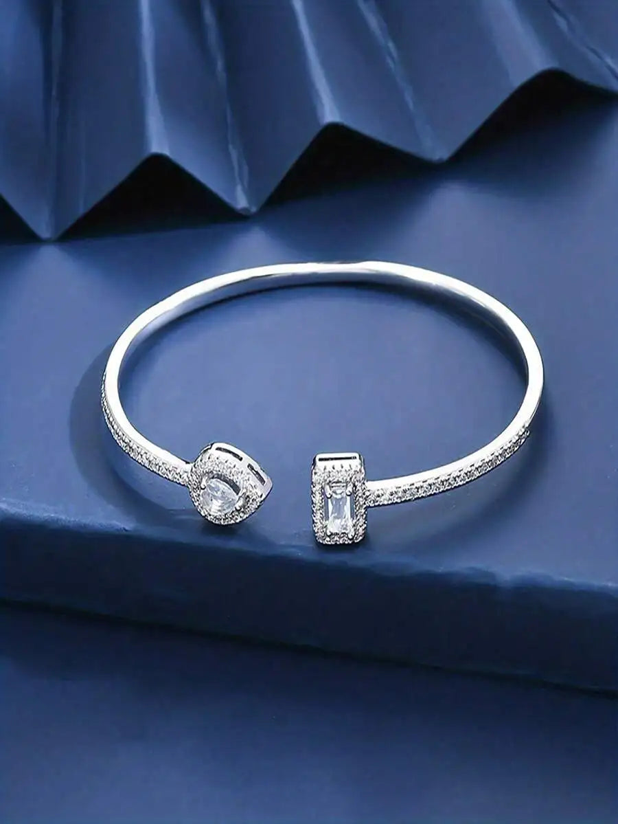 Cuff Bangle Bracelet With Rectangular And Teardrop Cubic Zirconia Accents, Silver-Tone