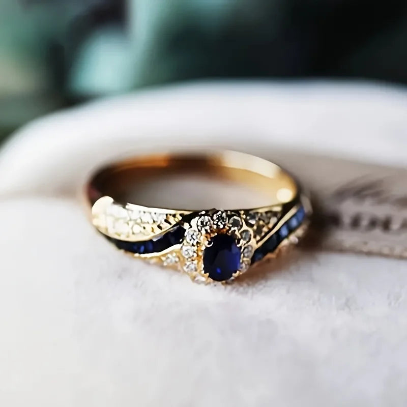 Elegant gold-plated  ring embellished with synthetic sapphire and synthetic zircon