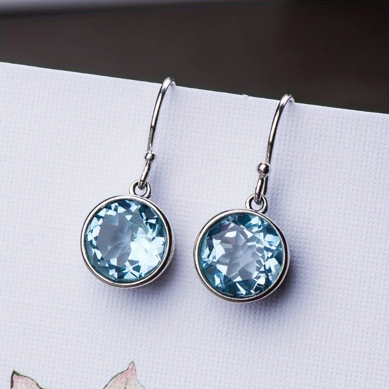 Beautiful Earrings inlaid with sea-blue synthetic zircon carved patterns