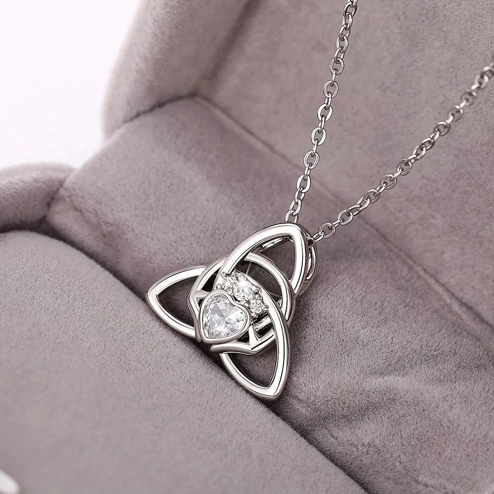 A Celtic knot triangle necklace - interwoven knot design, set with white synthetic zircon