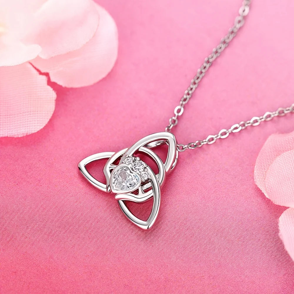 A Celtic knot triangle necklace - interwoven knot design, set with white synthetic zircon