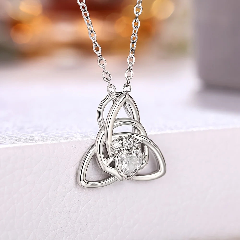 A Celtic knot triangle necklace - interwoven knot design, set with white synthetic zircon