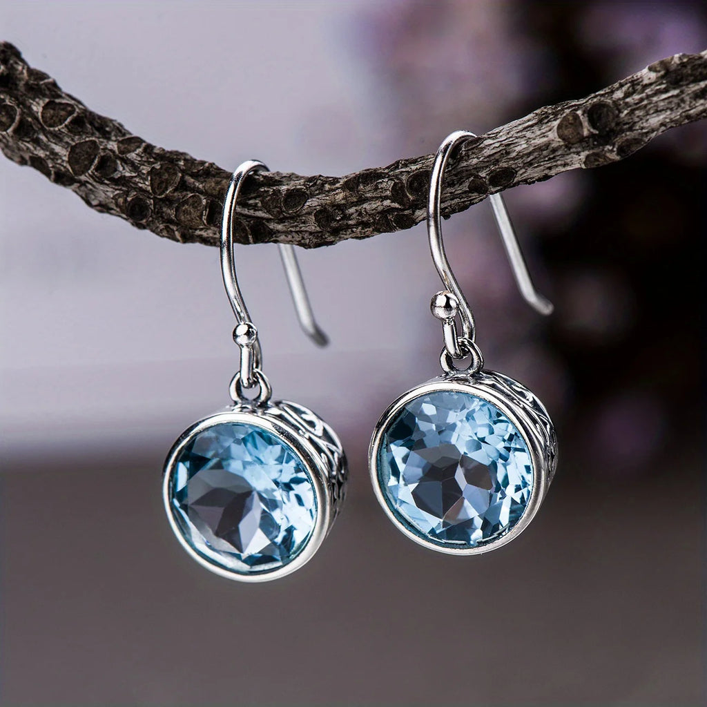 Beautiful Earrings inlaid with sea-blue synthetic zircon carved patterns
