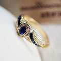 Elegant gold-plated  ring embellished with synthetic sapphire and synthetic zircon