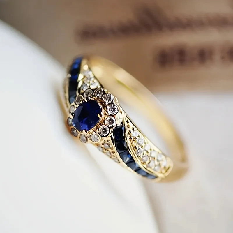 Elegant gold-plated  ring embellished with synthetic sapphire and synthetic zircon