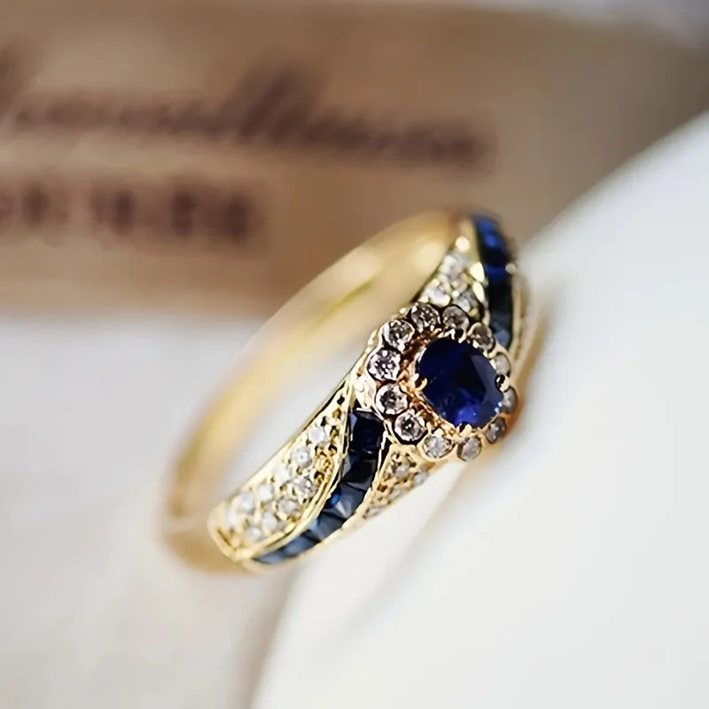 Elegant gold-plated  ring embellished with synthetic sapphire and synthetic zircon