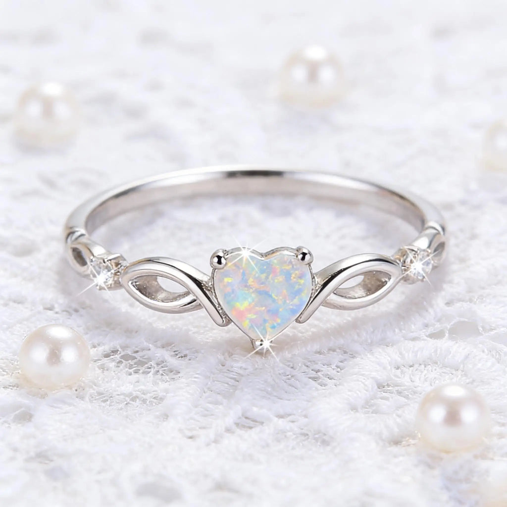 A heart-shaped opal silver ring with elegant and dynamic style, exquisite infinite symbol design