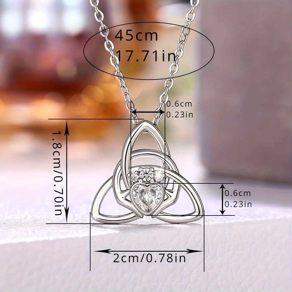 A Celtic knot triangle necklace - interwoven knot design, set with white synthetic zircon