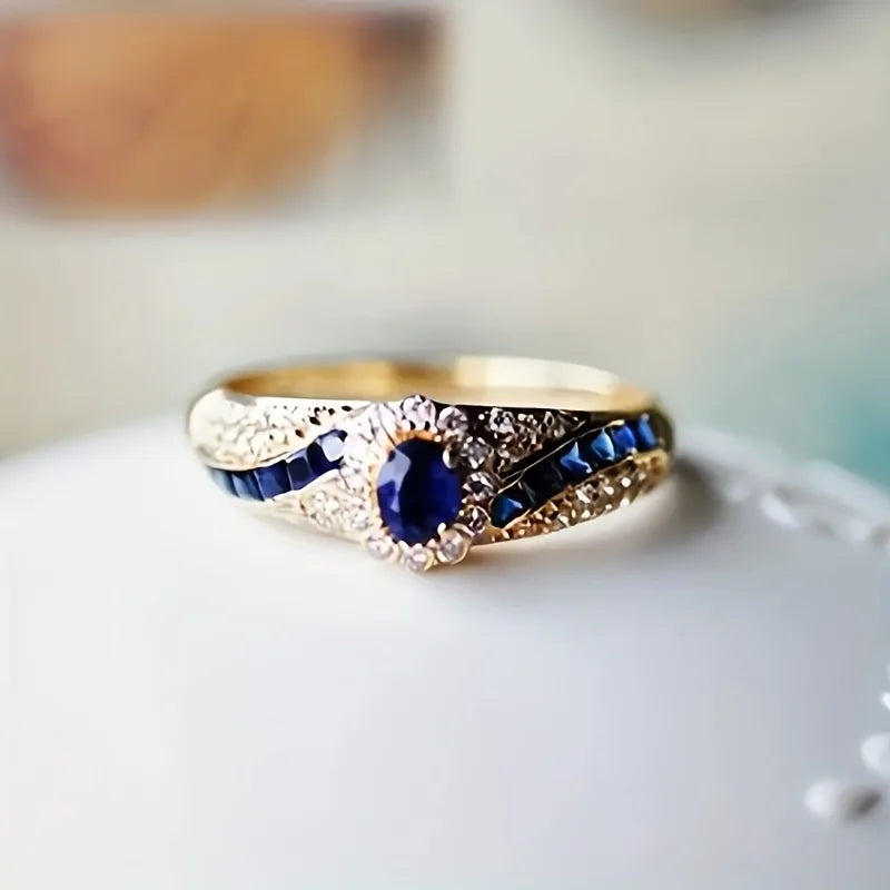 Elegant gold-plated  ring embellished with synthetic sapphire and synthetic zircon